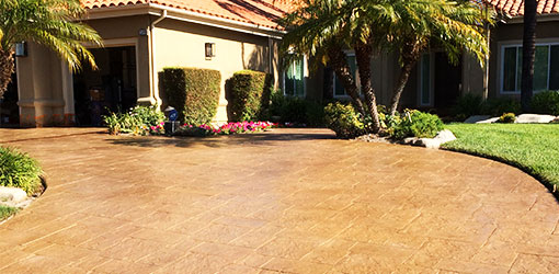 decorative concrete driveway desert sand staining and sealing.