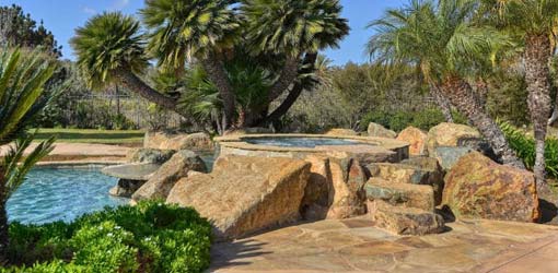 large flagstone pool deck with jacuzzi installation