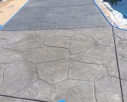 grey stamped concrete pool deck installation