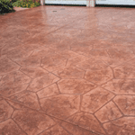 alt="stamped concrete patio installation."