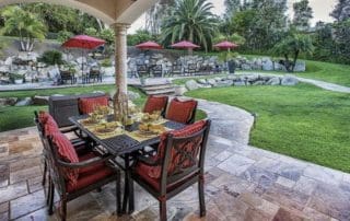 alt="back-yard-large patio -tamped-concrete with-turf-installation"
